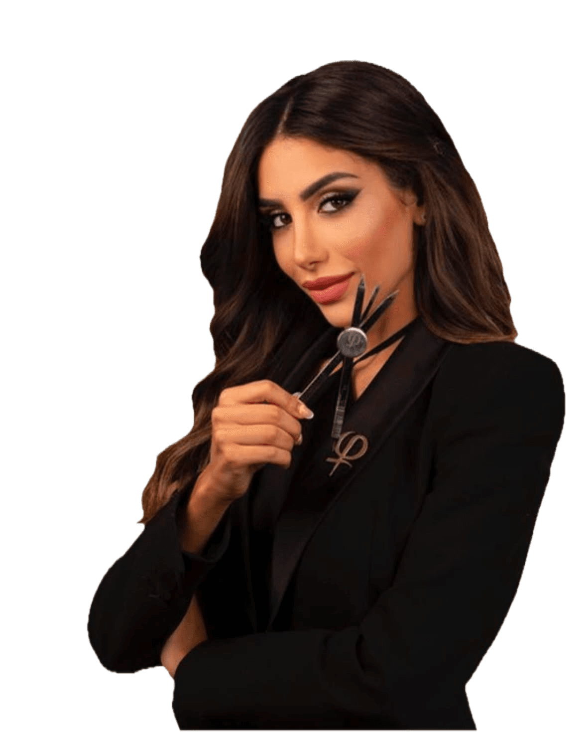 Amira Bechini in a black blazer, the brow calipers in her hand