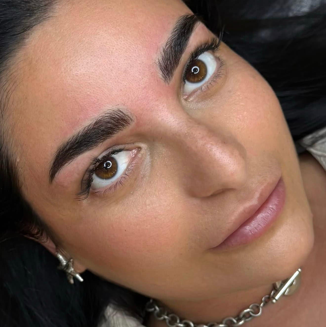 Defined brows, photographed close up after the treatment.
